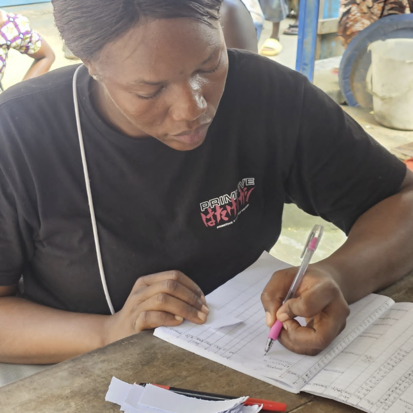 A nurse in Sierra Leone fills out a blood glucose log