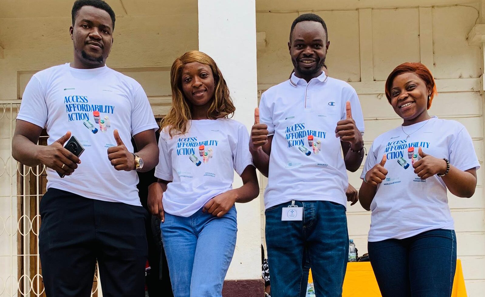Members of the staff team at Kivu Diabetes Center give thumbs up in their World Diabetes Day shirts