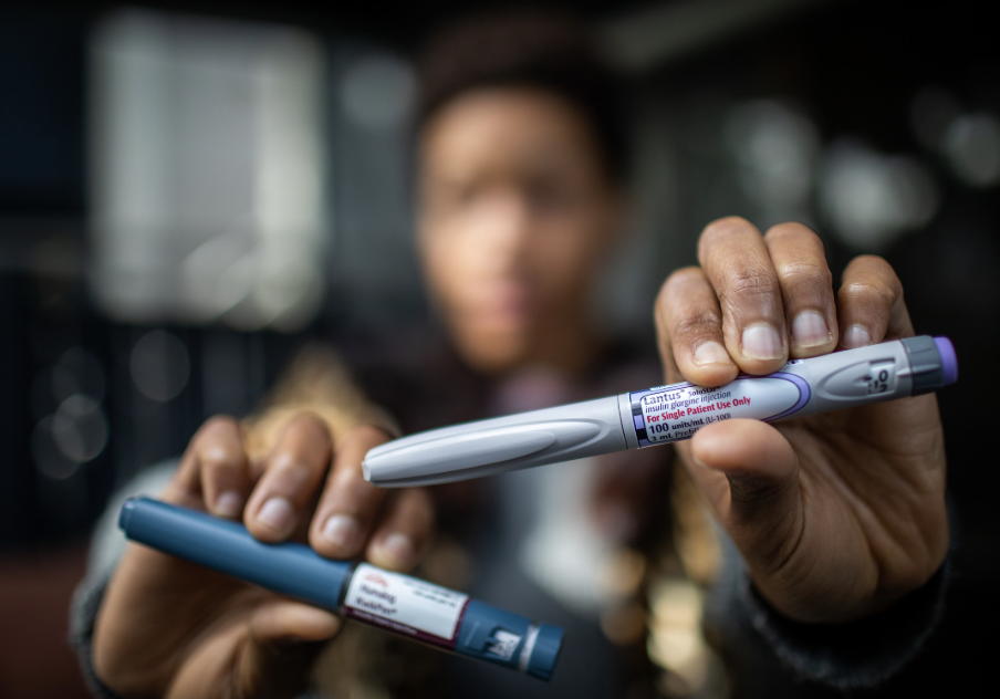 Diana holding insulin pens