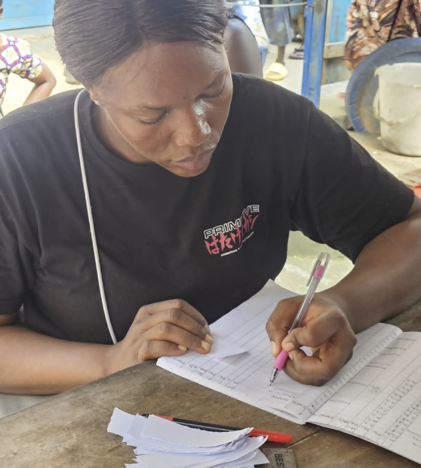 A nurse in Sierra Leone fills out a blood glucose log