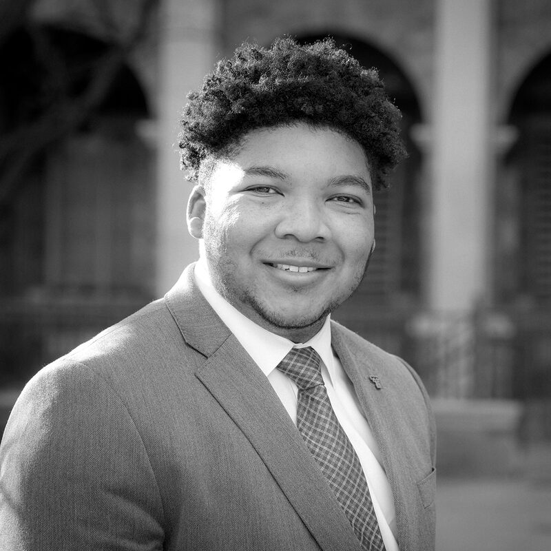 Black and white portrait of Cameron J. Hall.