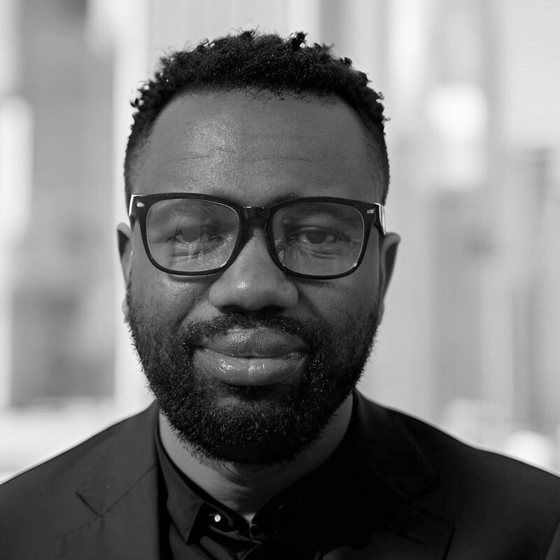 Black and white portrait of Olamide Adejumo.