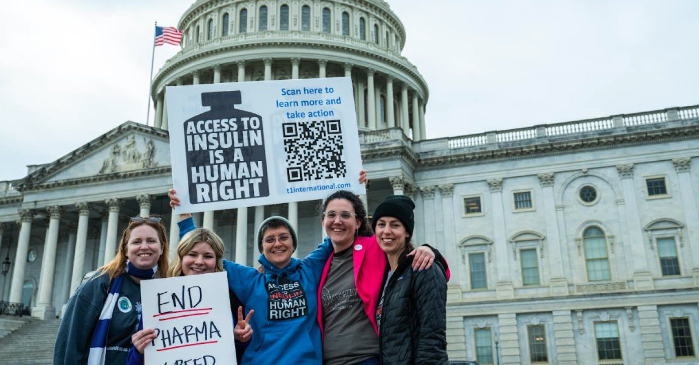 Advocates in "Access to Insulin is a Human Right" shirts holding signs in front of the United States Capitol
