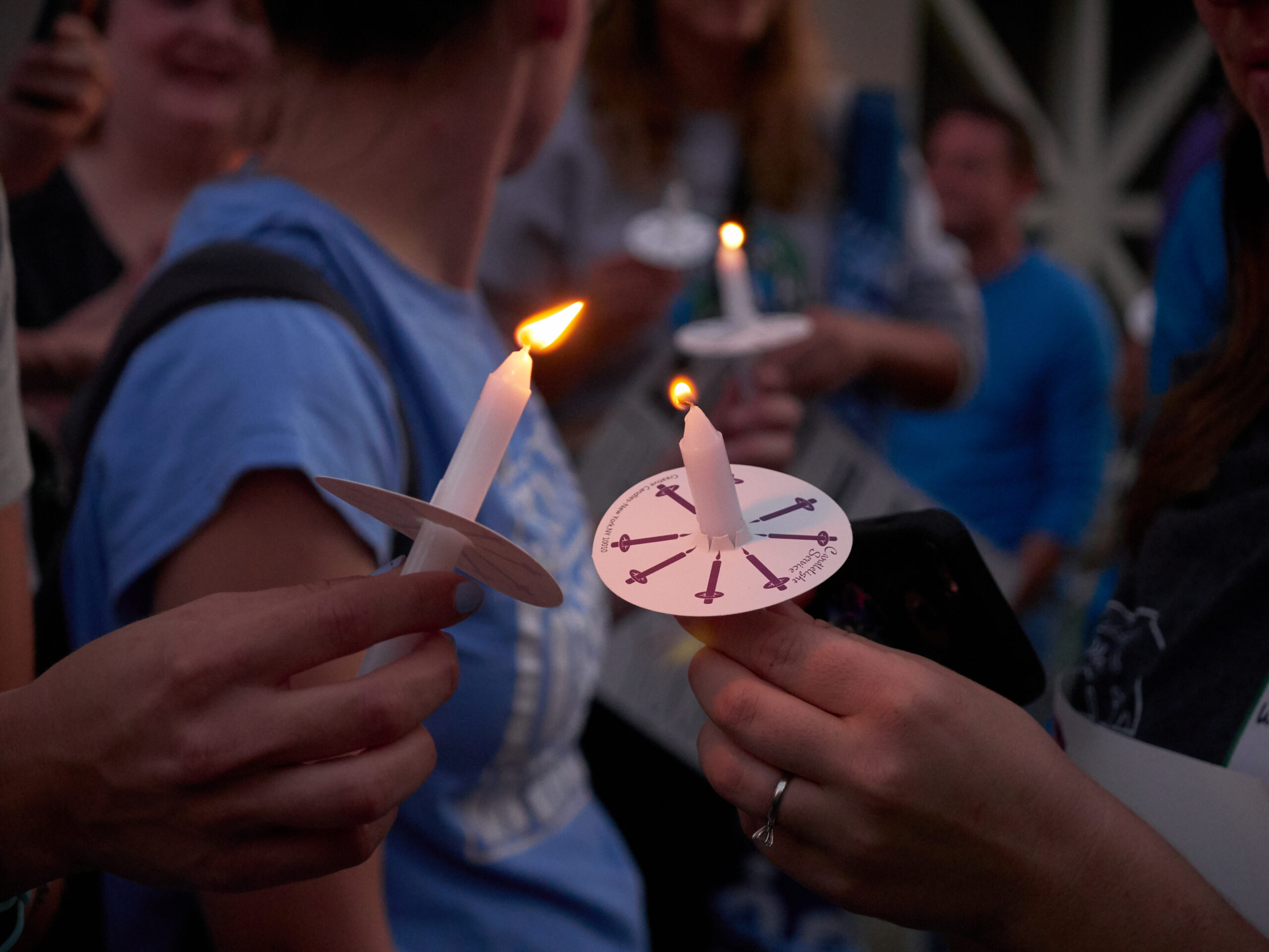 lighting candles at a vigil