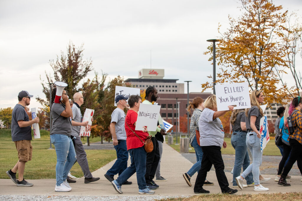 T1International team members and other advocates for affordable insulin participate in a campaign outside the Eli Lilly headquarters, where much of the US insulin supply is made, in Indianapolis, IN on Monday, October 24, 2022. T1I, is a non-profit advocacy organization founded by Elizabeth Pfiester who has had Type 1 diabetes since she was a child. Pfiester and her team, people with and impacted by type 1 diabetes, are working to achieve affordable insulin prices for all, no matter where a patient lives. © Photo by Erin Lubin