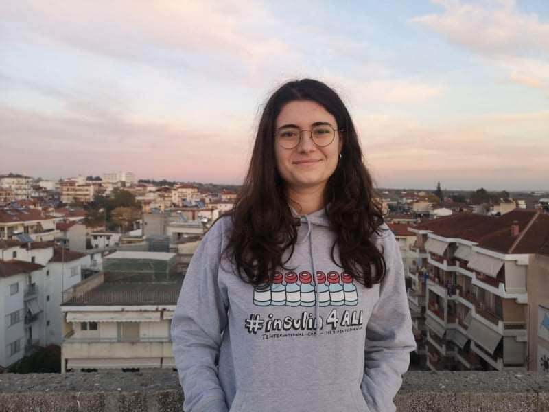 headshot of Konstantina, a woman in glasses and an #insulin4all sweatshirt looking directly at the camera