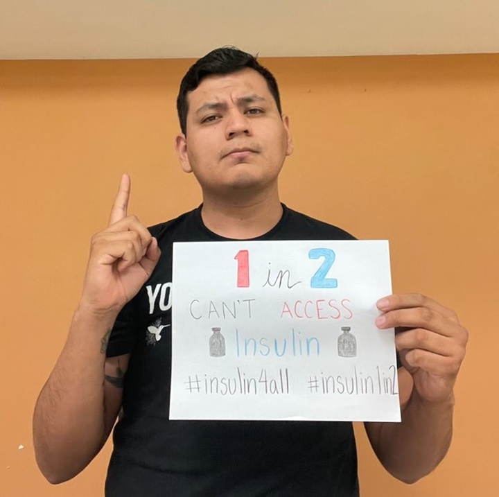 Jesus looking seriously at the camera with a hand holding up one finger in one hand and the other holding a piece of paper that says 1 in 2 people