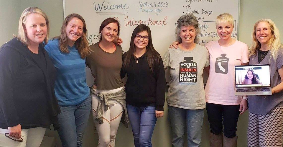 California Chapter members stand together wearing their 'access to insulin is  a human right' t-shirts.